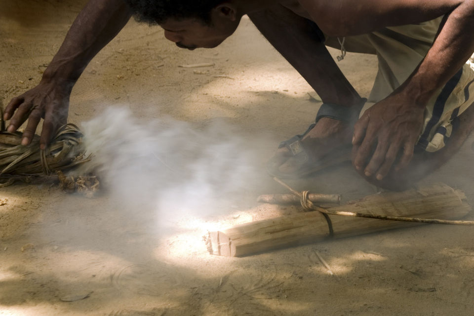 fire starting demonstration by orang asli batek in taman negara